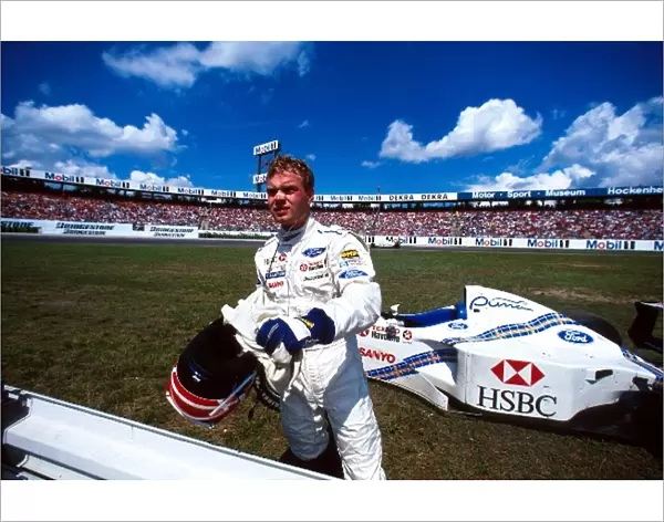 Formula One World Championship: Jan Magnussen Stewart Ford SF1 retires with blown engine