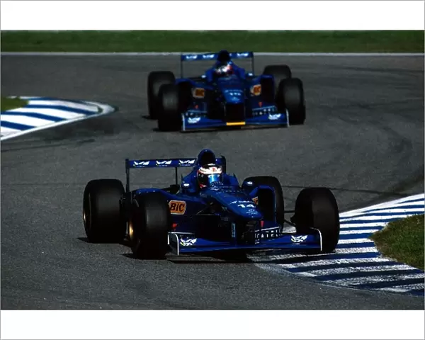 Formula One World Championship: Jarno Trulli Prost AP01, 4th place leads team mate Shinji Nakano Ligier