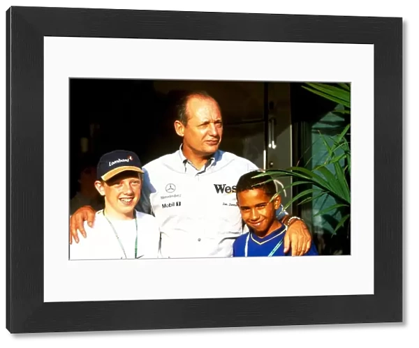 Formula One World Championship: Ron Dennis McLaren team principal with Lewis Hamilton, right and Andrew Delahunty from Kartings Champions of