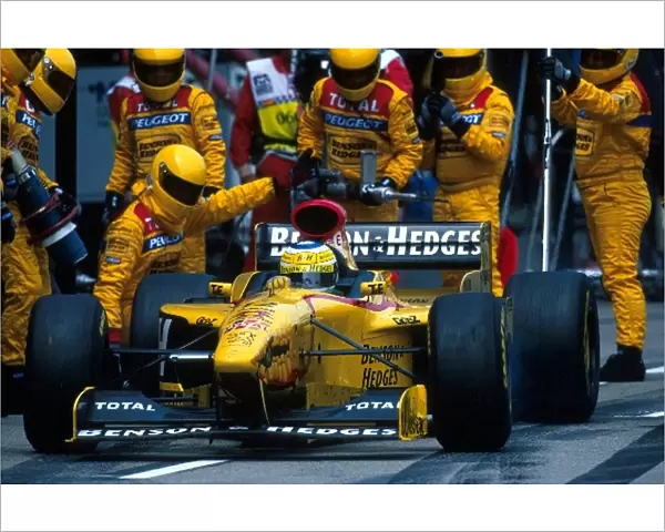 Formula One World Championship: Giancarlo Fisichella Jordan Peugeot 197 leaves his mechanics behind as he leaves the pits