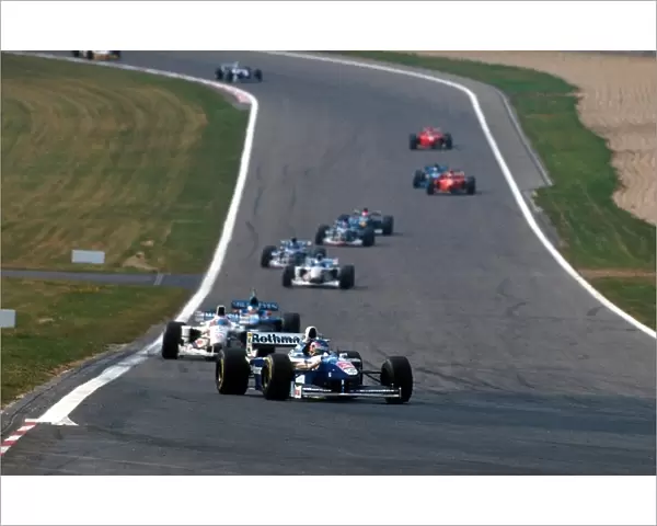 Formula One World Championship: Winner Jacques Villeneuve Williams FW19 leads
