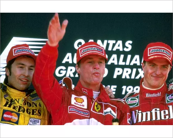 Formula One World Championship: The podium: Heinz-Harald Frentzen Jordan second; Eddie Irvine Ferrari first-time race winner; Ralf Schumacher
