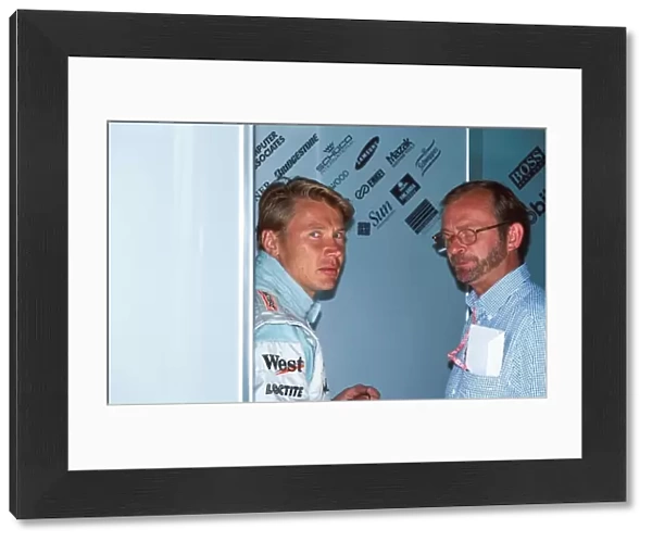 Formula One World Championship: Mika Hakkinen Mclaren MP4-14 with his Manager Didier