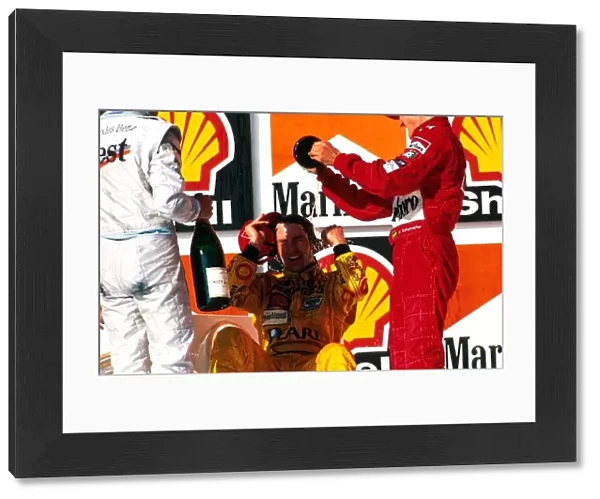 Formula One World Championship: Heinz-Harald Frentzen Jordan Mugen Honda 199 gets a bath on the podium