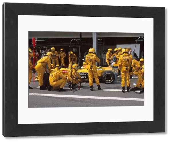 Formula One World Championship: Damon Hill Jordan Mugen Honda 199 makes a pit stop