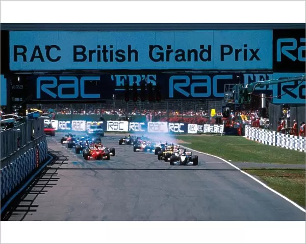 Formula One World Championship: Mika Hakkinen McLaren Merecedes leads at the start of the race