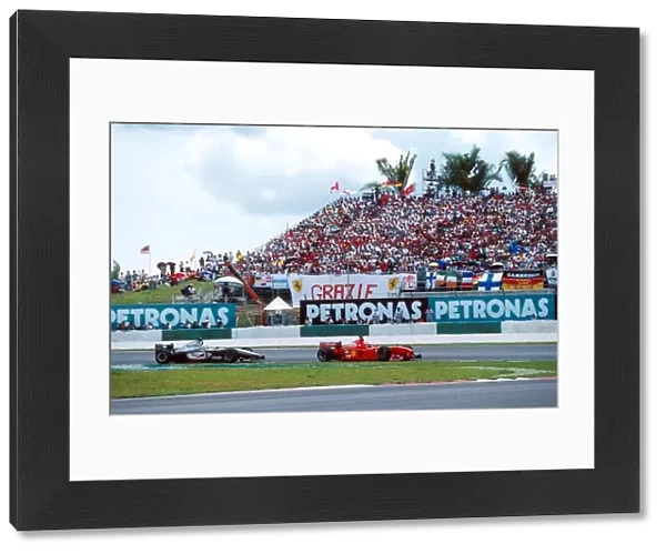 Formula One World Championship: Winner Eddie Irvine Ferrari F399 leads Coulthard