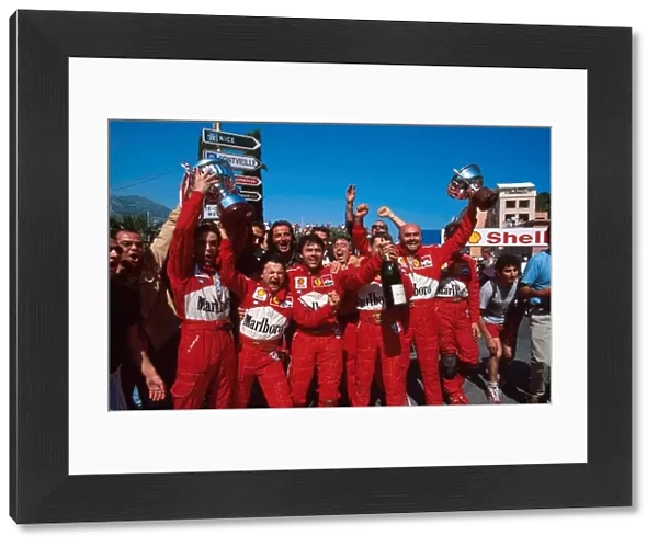 Formula One World Championship: The Ferrari team celebrate their 1-2 victory