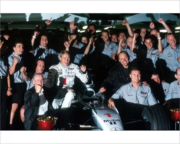 Formula One World Championship: Mika Hakkinen, David Coulthard and the Mclaren team celebrate their victory