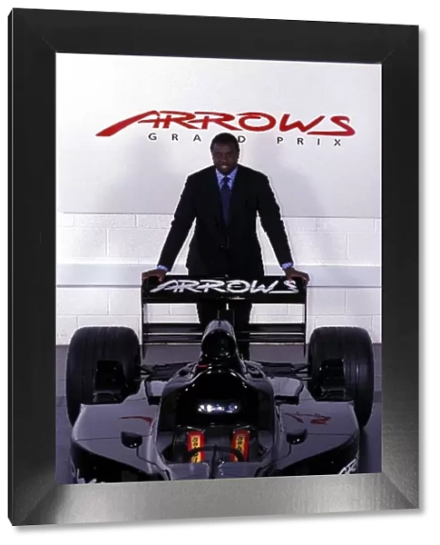 Formula One World Championship: Prince Malik Ado Ibrahim Investor in the Arrows team poses with the Arrows F1 car