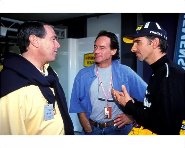 Formula One World Championship: Barry Sheene and Damon Hill Jordan chat with a VIP