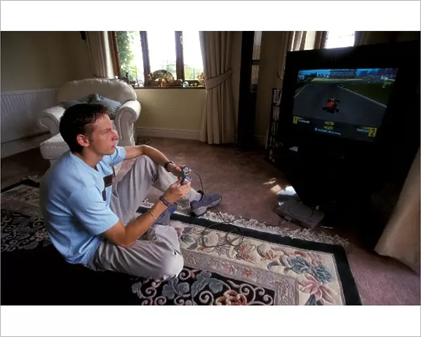 Jenson Button Lifestyle: Jenson Button relaxes by playing on a Playstation