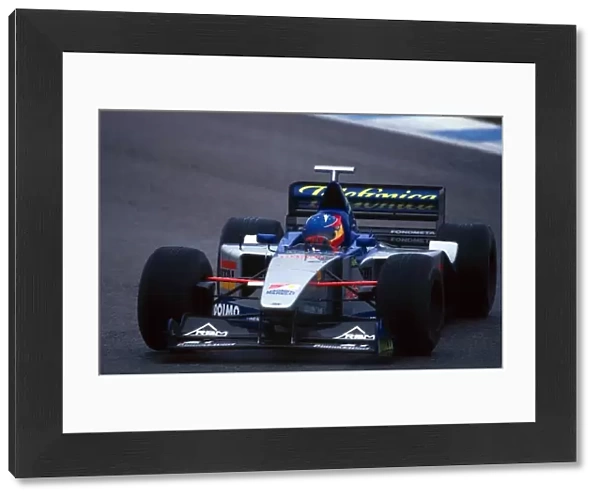 Formula One World Championship: Fernando Alonso, the 1999 Open Moviestar by Nissan Champion test drove the Minardi M101