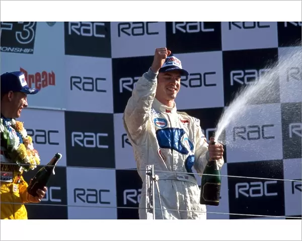 British Formula Three Championship: Race winner Marc Hynes, Manor Motorsport, right, and second placed Jenson Button, Promatecme, left, spray