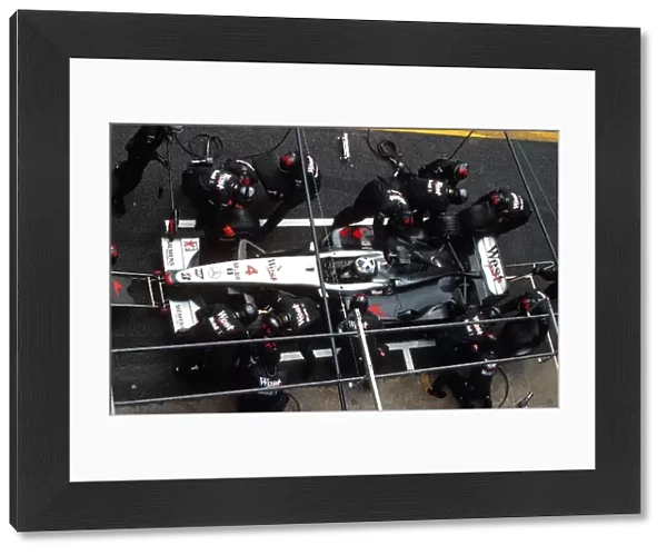 Formula One World Championship: Race winner David Coulthard Mclaren MP4-16 in for his pit stop