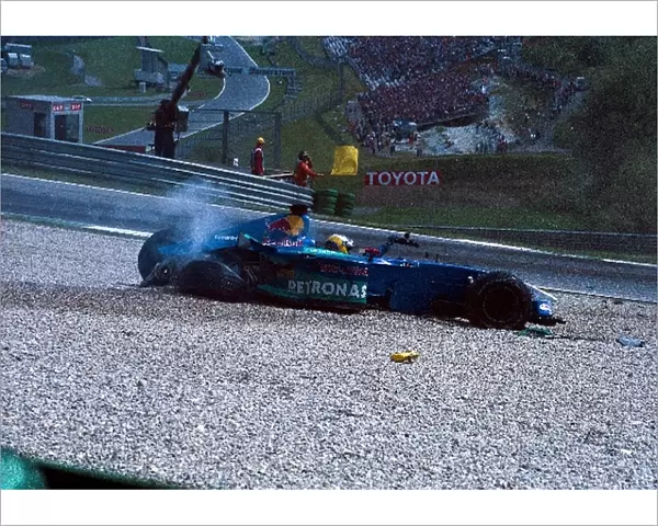 Formula One World Championship: Nick Heidfeld Sauber Petronas C21 climbs out of the car after a huge accident with Takuma Sato
