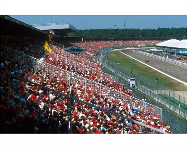 Formula One World Championship: A huge German crowd, most of whom supporting Ferrari, basked in the sunshine and enjoyed a home winner of the