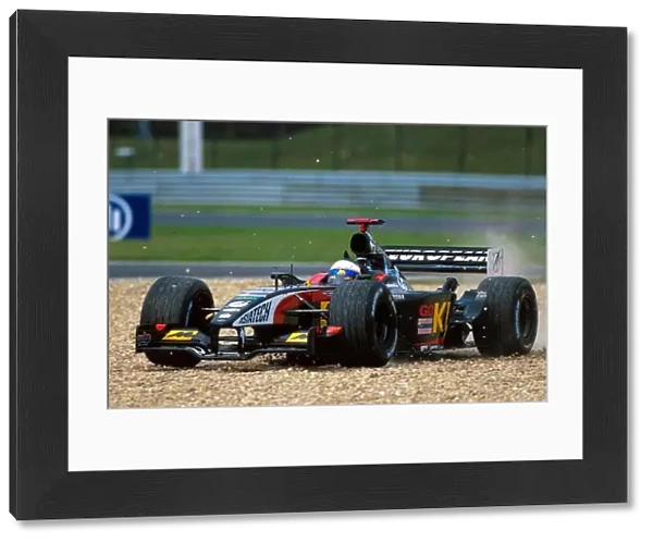 Formula One World Championship: Anthony Davidson Minardi Asiatech PS02 takes to the gravel during his debut Grand Prix