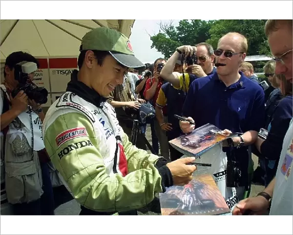 Goodwood Festival of Speed: BAR test driver and British Formula 3 star Takuma Sato happily signs autographs for the spectators