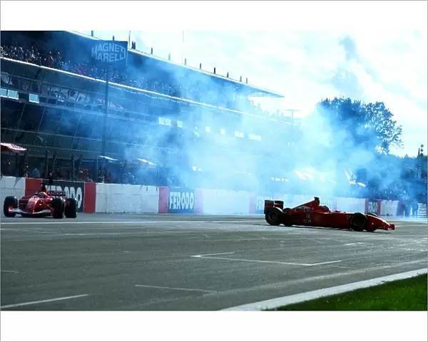 Formula One World Championship: Luca Badoer Ferrari F2001 takes avoiding action as Rubens Barichello spins his Ferrari F2001 for the crowd