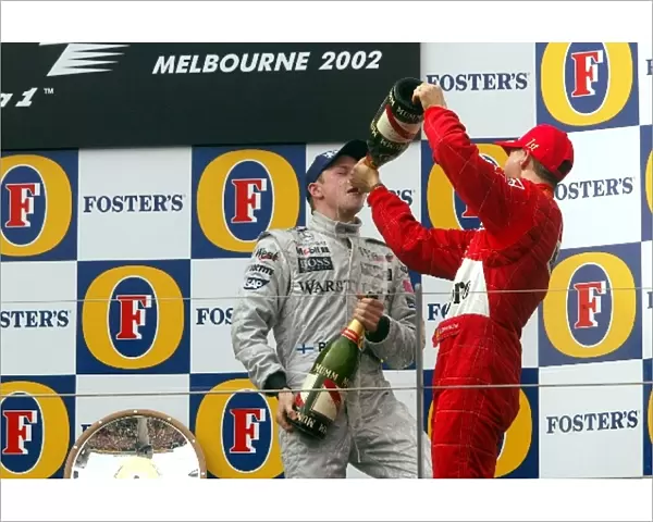 Formula One World Championship: L-R: Kimi Raikkonen, 3rd place, Michael Schumacher, winner