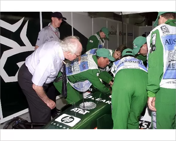 Australian Grand Prix: Professor Sid Watkins watches as safety marshals practice removing drivers from an F1 car