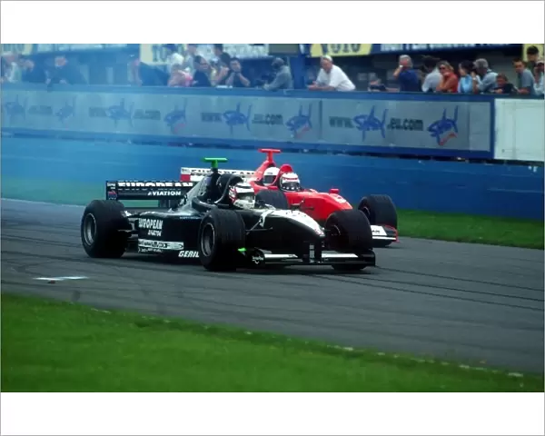 Minardi Thunder In The Park Day: l-r. Nigel Mansell gets the better start ahead of Minardi team owner Paul Stoddart in the sports first two-seater