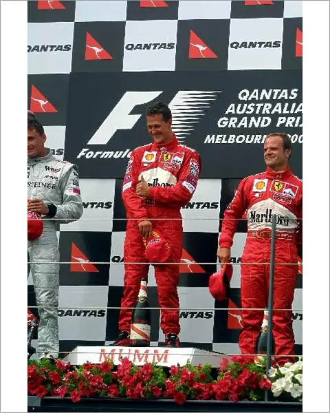 Australian GP: Michael Schumacher, with 2nd placed, David Coulthard, left, and 3rd Rubens Barichello, right