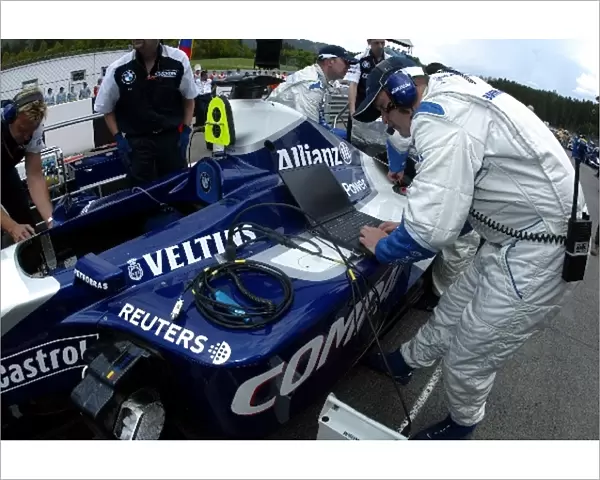 Formula One World Championship: The Williams FW24 of Juan Pablo Montoya is prepared on the grid