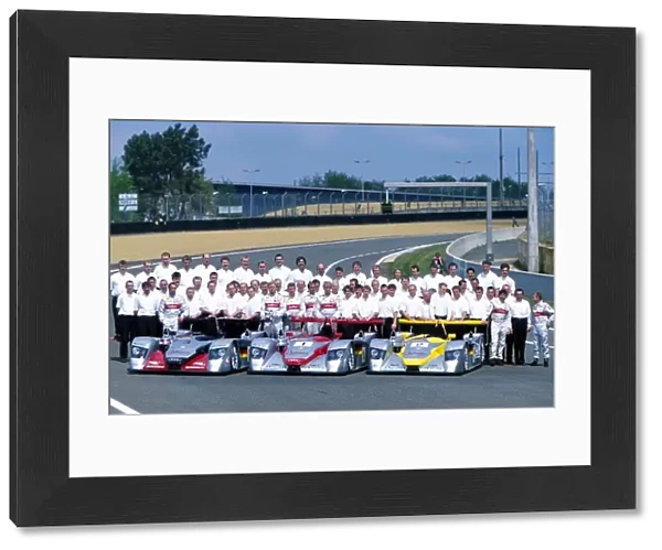 Le Mans Pre-qualifying: The Audi Sport entries pose for a picture including Team personnel, managers, drivers and mechanics