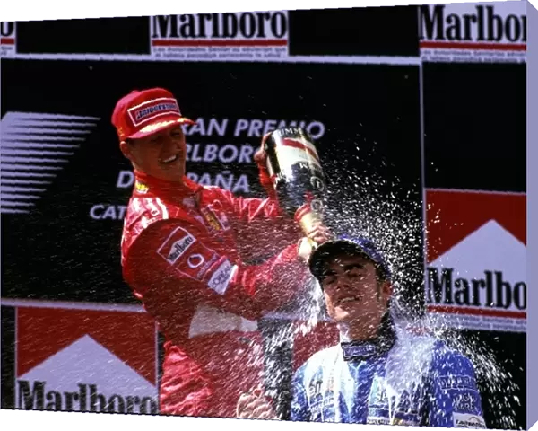 Formula One World Championship: Winner Michael Schumacher Ferrari covers second placed Fernando Alonso Renault with champagne