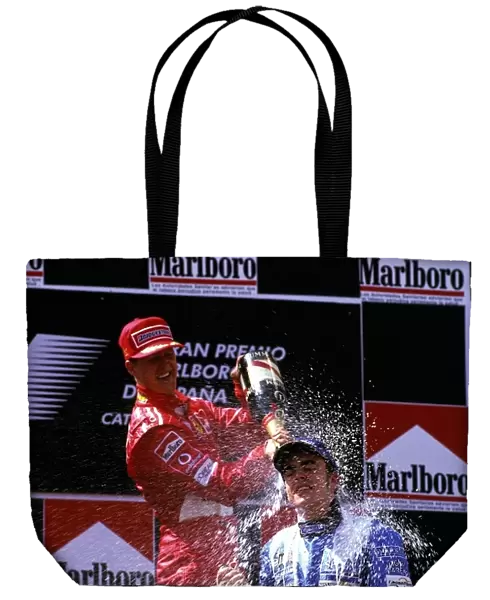 Formula One World Championship: Winner Michael Schumacher Ferrari covers second placed Fernando Alonso Renault with champagne