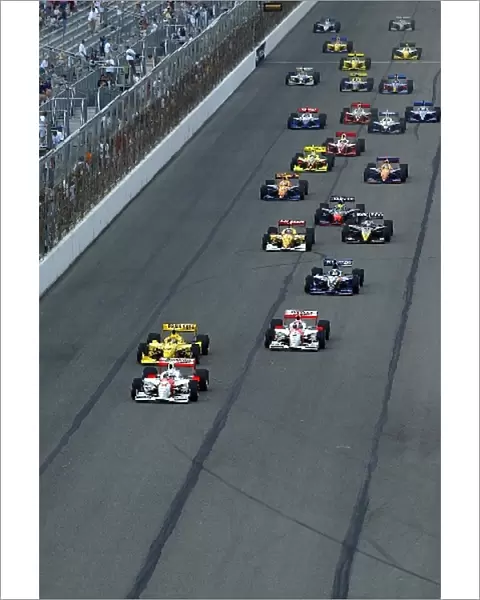 Indy Racing League: Gil de Ferran Team Penske leads the field into turn one at the start of the Gateway Indy 250