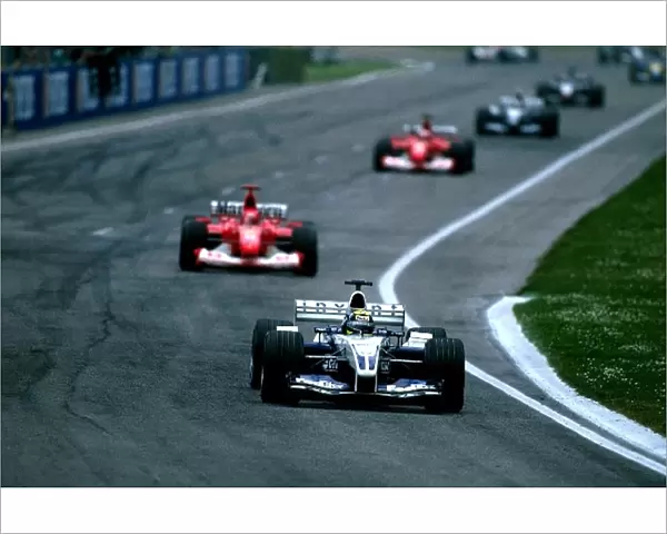 Formula One World Championship: Fourth placed Ralf Schumacher Williams BMW FW25 battles for the lead with brother Michael Schumacher Ferrari F2002