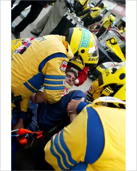 Formula One World Championship: The safety team practice removing a Sauber team member from the car