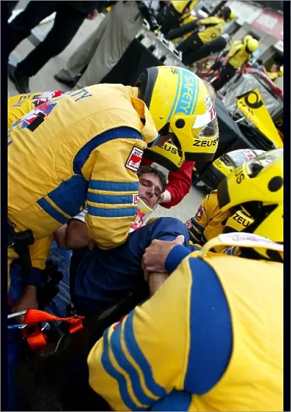 Formula One World Championship: The safety team practice removing a Sauber team member from the car