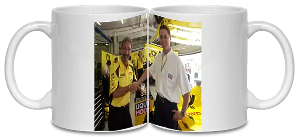 Formula One World Championship: Jordan Team Owner Eddie Jordan with Peter Baumann the Marketing Director of Liqui Moly
