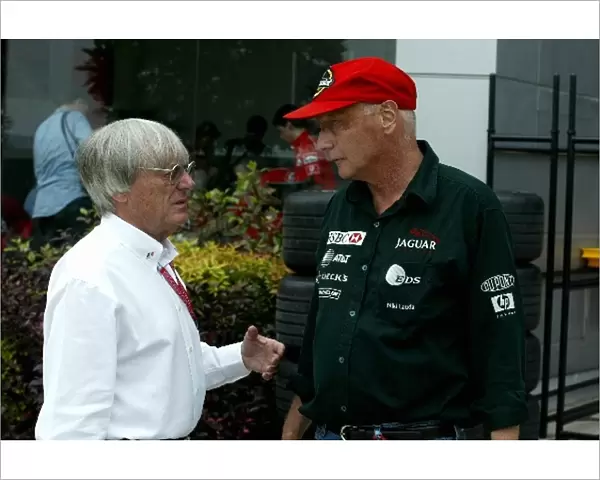 Formula One World Championship: F1 Supremo Bernie Ecclestone talks with Jaguar Team Principal Niki Lauda