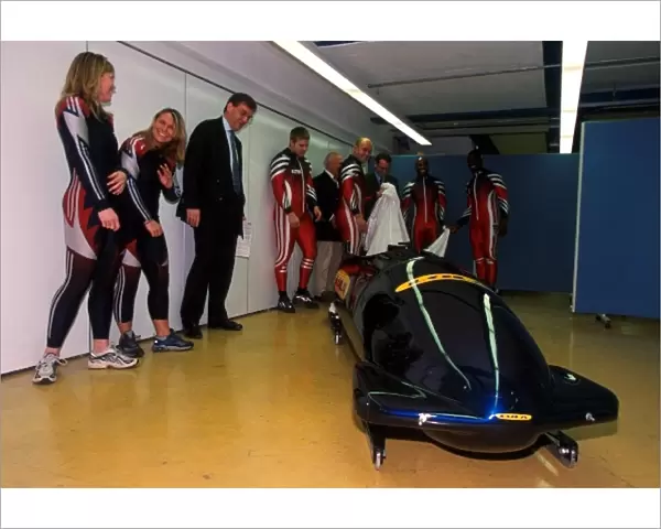 Winter Olympics: The male and female British four-man bobsleigh teams with Christopher Tate unveil the Lola designed bob that will be debuted