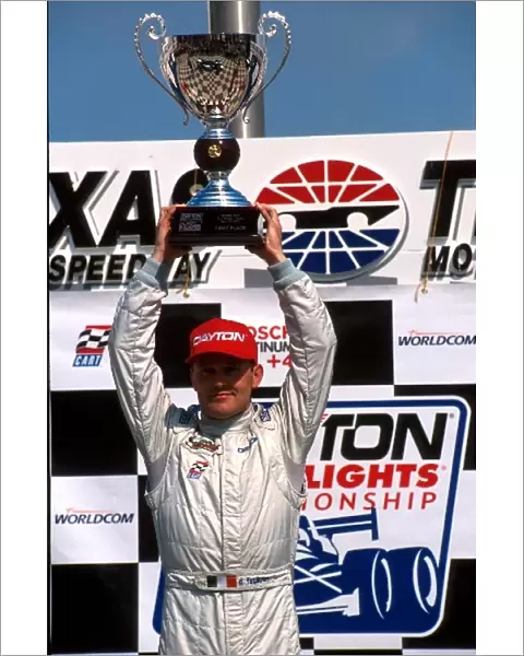 Indy Lights: Race winner Damien Faulkner raises his trophy