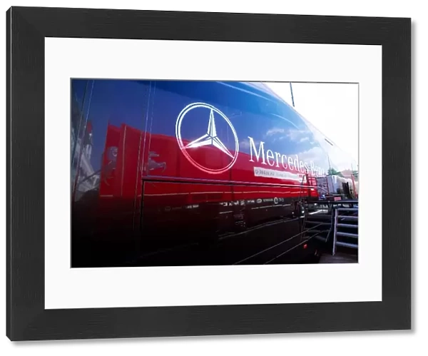 Formula One World Championship: A McLaren Mercedes transporter with a Ferrari truck in the reflection