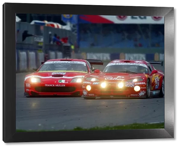 FIA GT Championship: A Chrysler and Ferrari head down into Copse Corner with headlights ablaze