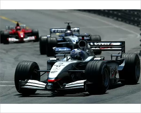 Formula One World Championship: Race winner David Coulthard McLaren Mercedes MP4-17 is followed by Juan Pablo Montoya BMW Williams FW24 and Michael