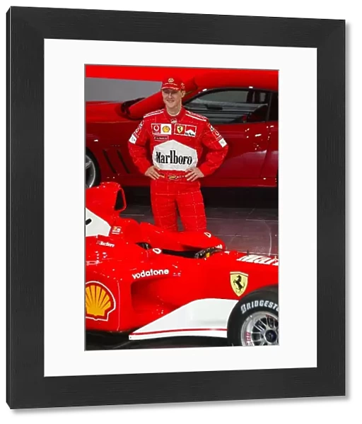 Formula One Launch: 2001 F1 World Champion Michael Schumacher stands alongside the Ferrari F2002