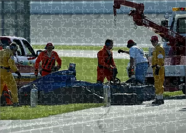 Indianapolis 500 Practice: The remains of Robby McGehees car after being the first driver to crash into the Safe Walls at the Indianapolis