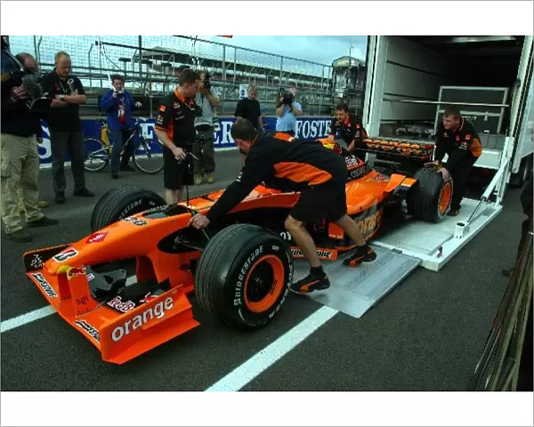 Formula One World Championship: The Arrows team get their cars to the circuit in time for their delayed scrutineering