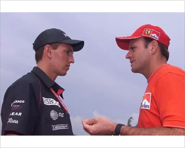 Formula One World Championship: Luciano Burti Jaguar Cosworth R2 talks with fellow Brasilian Rubens Barrichello Ferrari F1 2001