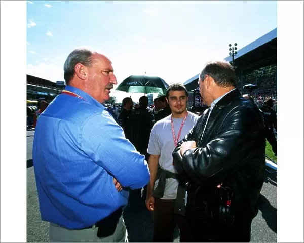 Formula One World Championship: McLaren team director Ron Dennis chats with Saudi Royal Prince, Khaled Al Waleed, centre, and his representative