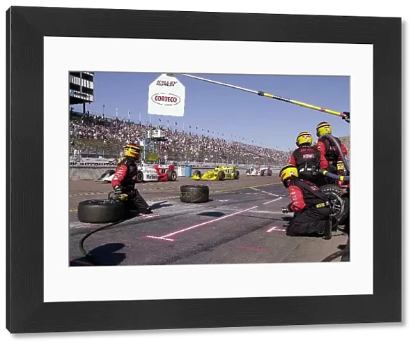 De Ferran, Hornish, and Castroneves, pass by Al Unser Jr.s pit box during the Copper World 200