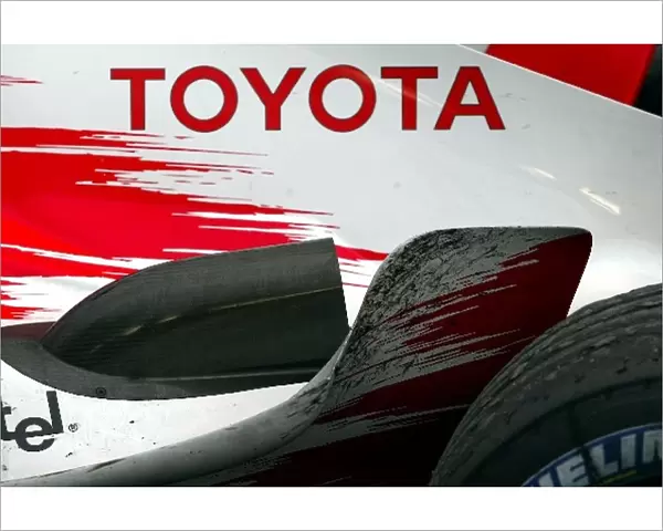 Formula One World Championship: A dirty Toyota TF104 in parc ferme